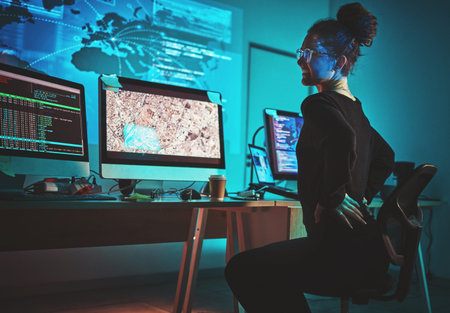 Woman, back pain and computer programmer, software engineering or cybersecurity at night, stress and...