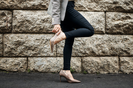 Outdoor, heels fix and business woman on road with shoes and job fashion on work commute. City travel, female professional and walking on a urban pavement, street and sidewalk with legs and handsの写真素材