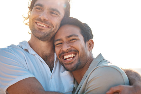 Love, hug and gay couple, men with sky and smile on summer vacation together in Thailand. Sunset, ocean and romance, happy lgbt people embrace in nature on fun holiday with pride, laughing and fun.の写真素材