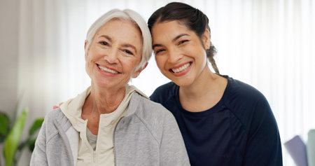 Happy, portrait of mom and grandmother in home with a smile for family, quality time or relax on mothers day in house. Senior woman, grandma and girl together with happiness, support and loveの写真素材