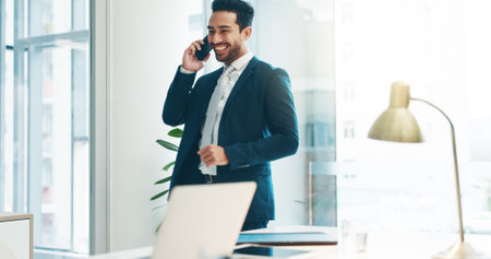 Business, asian man and phone call communication in office for feedback, negotiation and trading on mobile. Broker, corporate agent and talking on smartphone for contact, consulting and conversationの写真素材