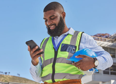 Black man, online or architect with phone on construction site for building update, social media or...