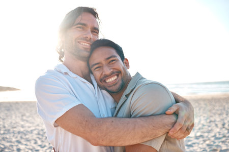 Love, happiness and gay couple on beach, hug and laugh on summer vacation together in Thailand. Sunshine, ocean and smile, lgbt couple embrace in nature for fun holiday with pride, sea and sand.の写真素材
