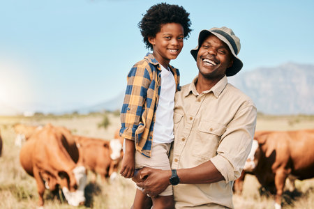 Happy black man, portrait and child with animals on farm for agriculture, sustainability or live stock cattle. African male person, dad and boy kid smile for natural farming or produce in countrysideの写真素材