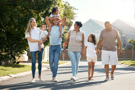 Outdoor, big family and walking in neighbourhood street together for fun, bonding or activity with...