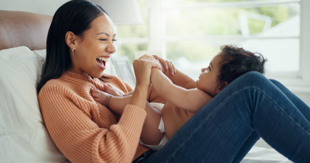 Relax, smile and mother with baby on bed for playful, love and free time. Happiness, care and health...