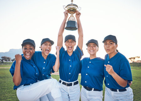 Baseball, team trophy and winning portrait with women outdoor on a pitch for sports competition. Professional athlete or softball player group celebrate champion prize, win and achievement at a gameの写真素材