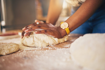 Baking, hands and woman in a kitchen for bread, pizza or handmade food at home. Wheat, mix and...