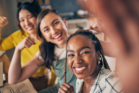 Women, friends and selfie with strong arm flex at home bond, fun and relax at home. Portrait, happy and feminist influencer people with diversity smile for social media, blog or vlog profile pictureの写真素材