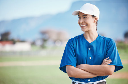 Sports, baseball and woman with arms crossed on a field for training, match or fitness goals on...