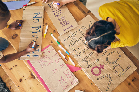 Girl group, sign and writing for protest, top view and support for diversity, power and goals in home. Women friends, cardboard poster and design with billboard for justice, human rights or inclusionの写真素材