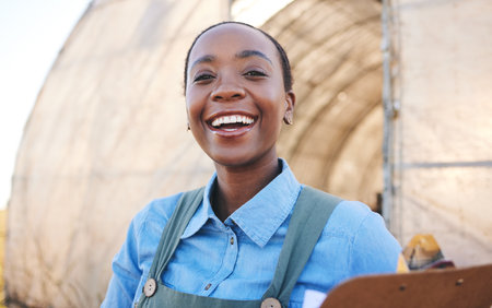 Portrait, black woman and farm with clipboard for sustainability, management or quality control in countryside. Face, smile and farmer with checklist for distribution stock at poultry supply chainの写真素材