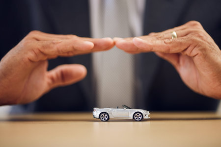 Desk, hands and a person with car insurance or covering for safety or business. Office, investment...