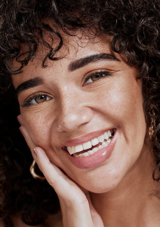 Closeup, woman and skincare for wellness, natural beauty and confident for makeup brand and fresh. Cosmetics, female and healthy girl with smooth face, organic facial or smile with freckles and happyの写真素材