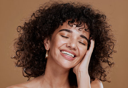 Beauty, self care and face of model with skincare glow, spa wellness routine or natural cosmetics treatment. Salon curly hair care, luxury facial healthcare and woman happy with aesthetic makeupの写真素材