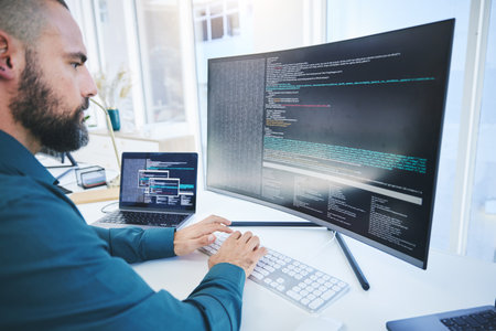 Programmer, technician man and computer code for software script or cyber security in office. IT engineer or developer person with technology for programming, future and data analytics or codingの写真素材