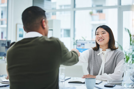 Interview, business people and human resources, handshake and recruitment, onboarding and conversation. Communication, hiring and meeting with feedback, promotion and shaking hands with trustの写真素材