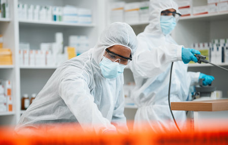 Pharmacy, emergency disinfection and people spray chemical for protection, cleaning hospital or contamination risk. Safety policy, toxic bacteria outbreak or healthcare team sanitize medical facilityの写真素材