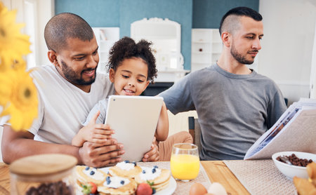 Gay family, tablet and child with breakfast at home for e learning, bonding and education on internet. Adoption, lgbt men or parents with a happy kid and technology in morning with food on a tableの写真素材