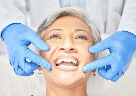 Senior woman, mouth and dentist hands with dental procedure, medical and healthcare with closeup....