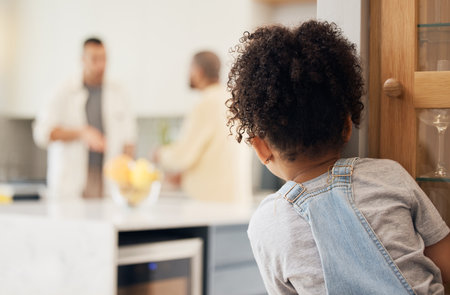Divorce, gay couple and girl child watching parents argue in kitchen with stress, worry or fear at home. Family, crisis and homosexual men dispute foster kid custody, affair or conflict in houseの写真素材