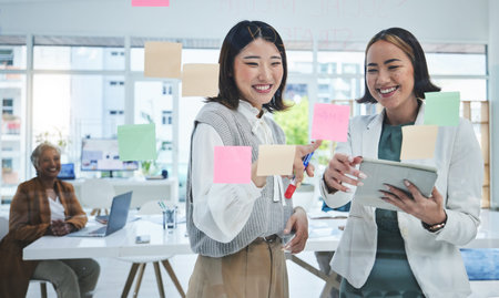 Business women, tablet and planning on glass board for marketing timeline, project priority and...