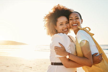 Portrait, lgbt couple hugging on the beach at sunset together for romance or bonding on a date. Mockup, love and a gay woman with her lesbian girlfriend by the sea or ocean for honeymoon vacationの写真素材