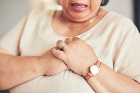 Heart attack, healthcare and closeup of a senior woman with chest pain, injury or accident. Medical...