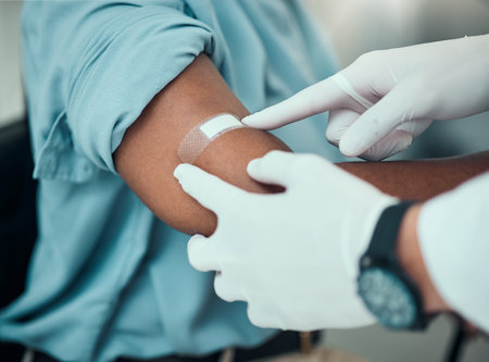Plaster on arm, vaccine and wound, hands of doctor with patient and health, medicine and medical...