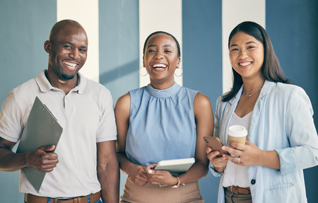 Smile, laughing and portrait of a business people in the office with confidence and happiness. Young, career and face headshot of a team of professional lawyers standing in a modern legal workplace.の写真素材