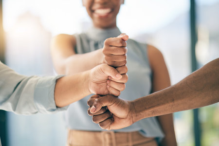 Fist bump stack, support or business people for motivation, teamwork or mission in collaboration. Partnership, hands closeup or employees meeting in huddle with goal, vision or solidarity togetherの写真素材