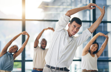 Team building, stretching and a team of business people in the office to workout for health or...