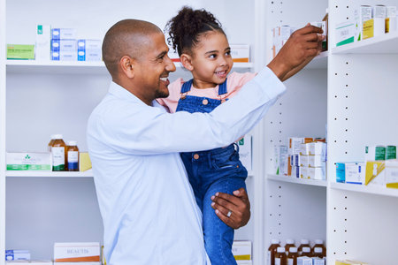 Pharmacy, child help and family with medication, learning and healthcare study for education. Pharmacist, father and young girl together with a smile from pharmaceutical research and kid developmentの写真素材