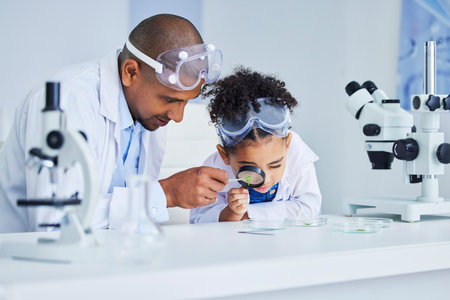 Lab work, father and child with magnifying glass for learning, research and science study. Scientist, student and chemistry project with dad and young girl with medical and laboratory analysisの写真素材