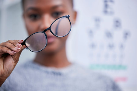 Optometry, eyesight and black woman with glasses for vision, eye care and optical health in clinic....