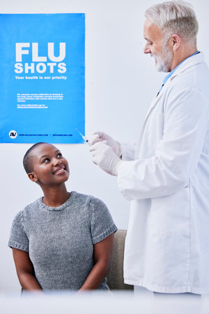 Flu vaccine, injection and black woman with doctor in clinic for virus protection, vaccination and shot. Healthcare, poster and health worker with patient for medicine, treatment and antibioticsの写真素材
