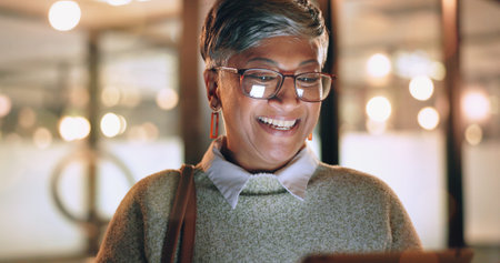 Face, tablet and senior woman in office laughing at funny meme or video at night. Technology, break...