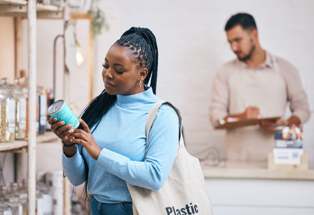 Shopping, grocery store and black woman by shelf for choice, options and service in eco friendly...