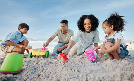 Parents, kids and sandcastle at beach, bucket and digging for bonding, outdoor and vacation in summer. Mom, dad and siblings with plastic toys, sand or construction game for holiday, happy and oceanの写真素材