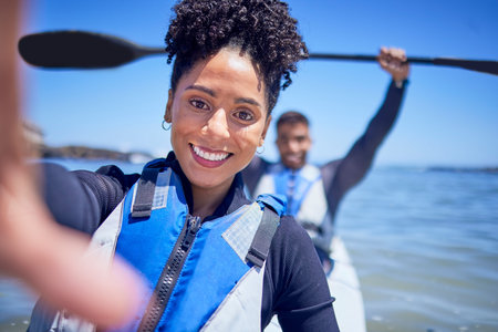 Ocean, kayak and couple with selfie, beach and summer vacation with memory, honeymoon and social...