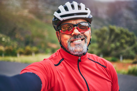 Happy man, cyclist and portrait in selfie on mountain bicycle for photograph, picture or outdoor memory in nature. Male person or athlete smile in photo, happiness or cycling in fitness or travelの写真素材