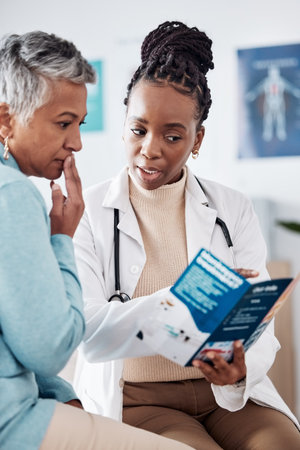 Brochure, consulting or doctor speaking to woman for life insurance or healthcare services or medical data. Medicine, nurse helping or mature patient learning info on pamphlet in hospital for adviceの写真素材