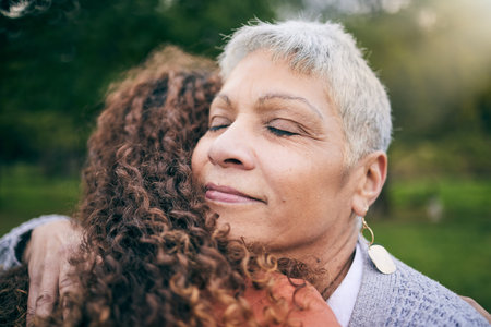 Senior mother, woman and hug at park with love, care and bonding for trust, support and wellness...