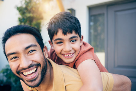 Face, smile and father piggyback child by home, bonding and excited together. Portrait, kid and dad...