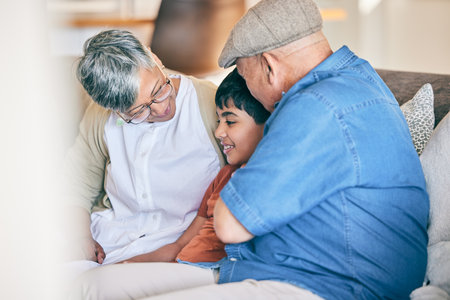 Talking, happy grandparents or kid in home bonding, laughing or smiling in fun Mexico in family house. Grandmother, grandfather or boy child speaking with love, care or support on holiday vacationの写真素材