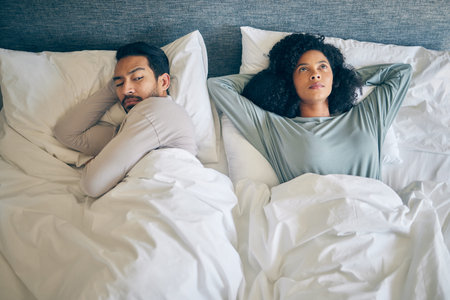 Interracial couple, fight and stress in bedroom for divorce, anger and thinking of breakup, cheating...