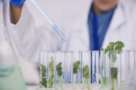 Science, leaves and hands with test tube in laboratory, research and thinking with nature. Biotechnology, pharmaceutical study and scientist with leaf, lab technician checking green plants in glass.の写真素材