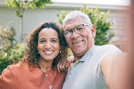 Portrait, father or happy woman in a selfie in garden as a family to relax on fun holiday together. Smile, faces or senior dad taking picture or photograph with his excited daughter in home backyardの写真素材