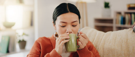 Thinking, coffee and Asian woman on couch, relax and decision with inspiration, decision and calm in...