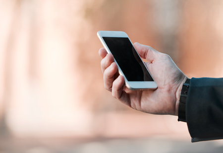 Business, hands and phone screen in city for travel, marketing and social media mockup in street....